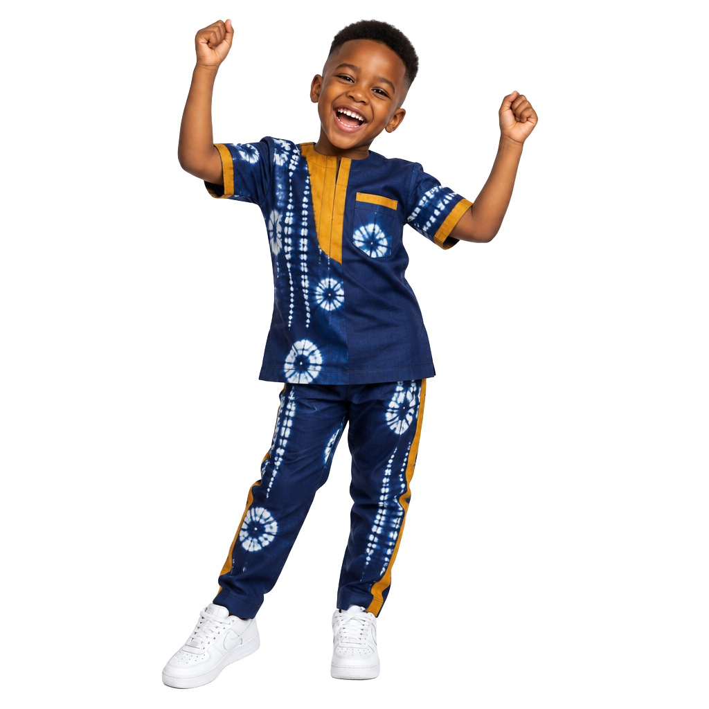 Young boy in Adire print, celebrating happily